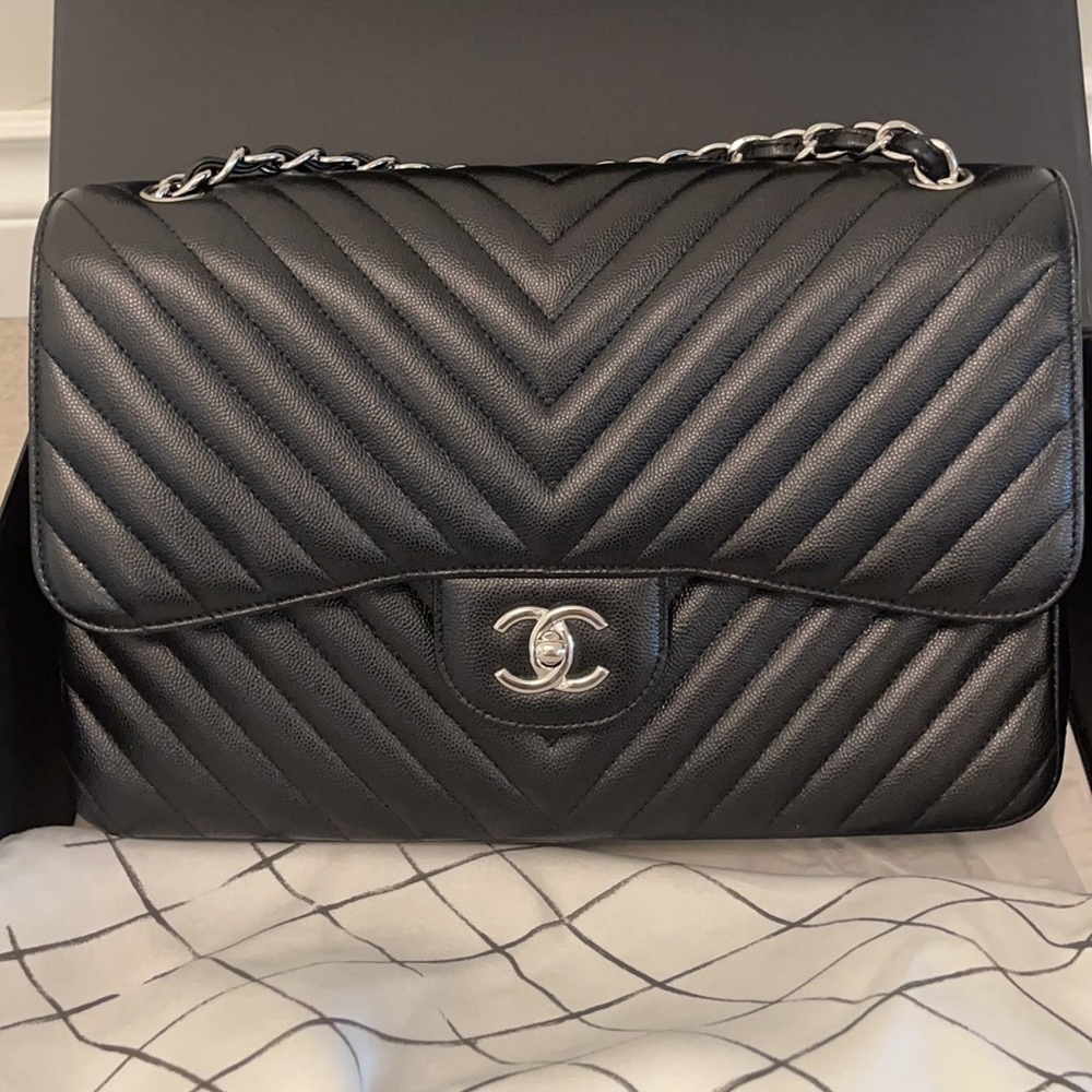 Chanel 
Jumbo Classic Flap Caviar Black Chevron SHW